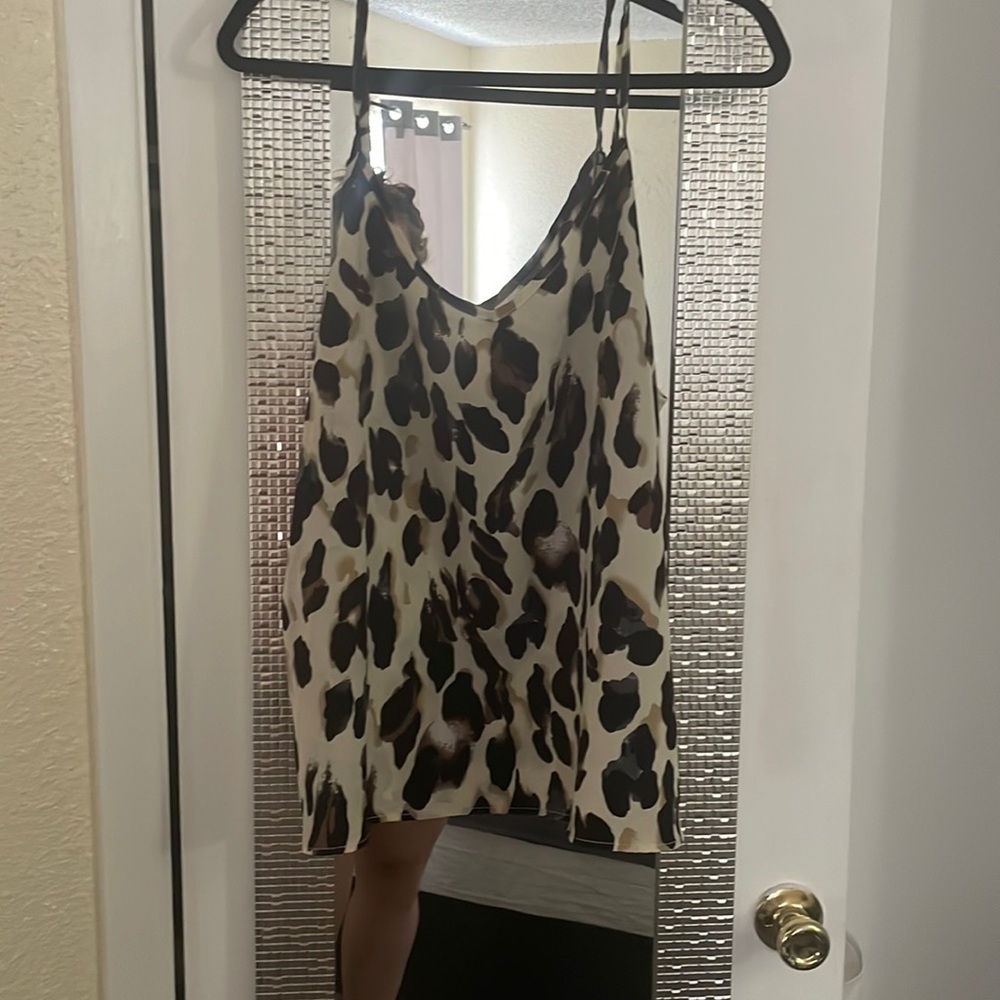 Cheetah print tank top with v neck , very flowey.